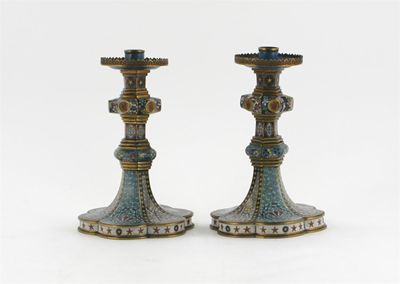 Appraisal: A pair of cloisonn candlesticks with hexafoil bases decorated with