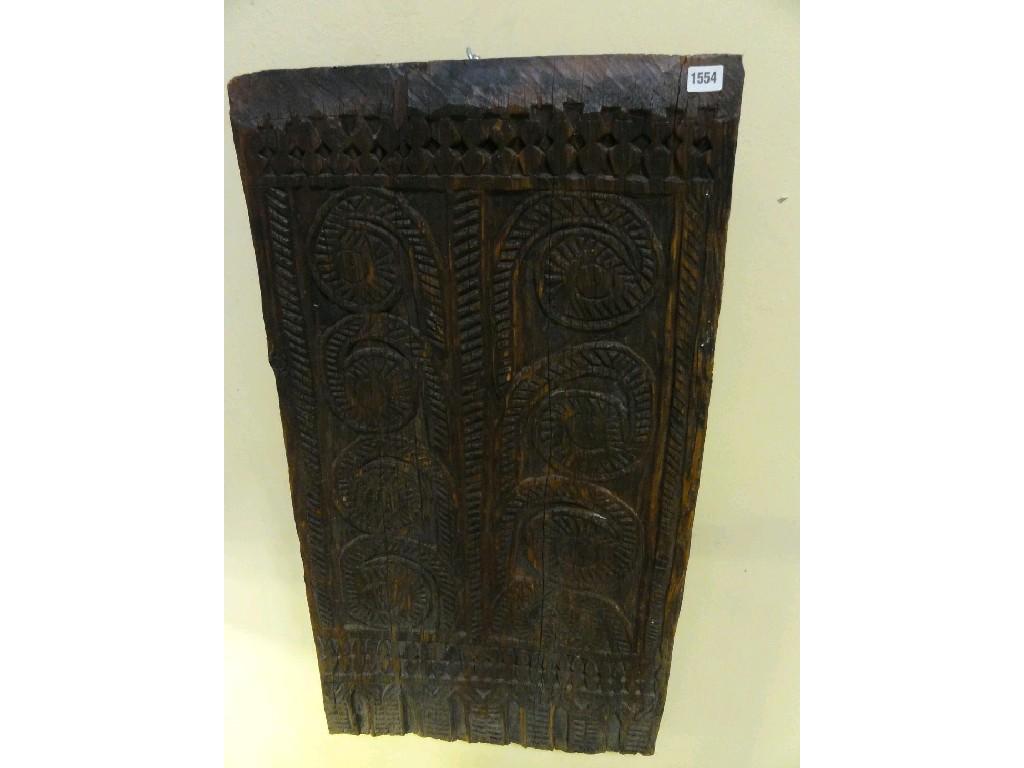 Appraisal: An antique timber panel of rectangular form with carved naive