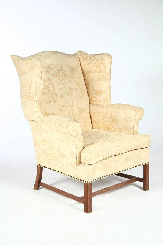 Appraisal: CHIPPENDALE-STYLE WING CHAIR Twentieth century mahogany Of typical form with