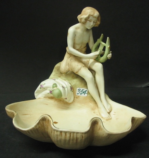 Appraisal: A CZECH FIGURAL PAINTED POTTERY BASIN The partially dressed figure