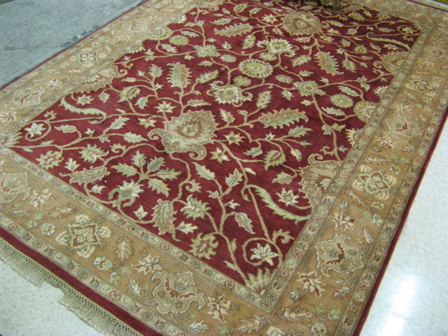 Appraisal: HAND KNOTTED ORIENTAL CARPET Pakistani Persian overall floral vine and