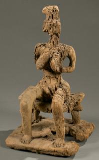 Appraisal: West African seated female figure th c A desiccated seated