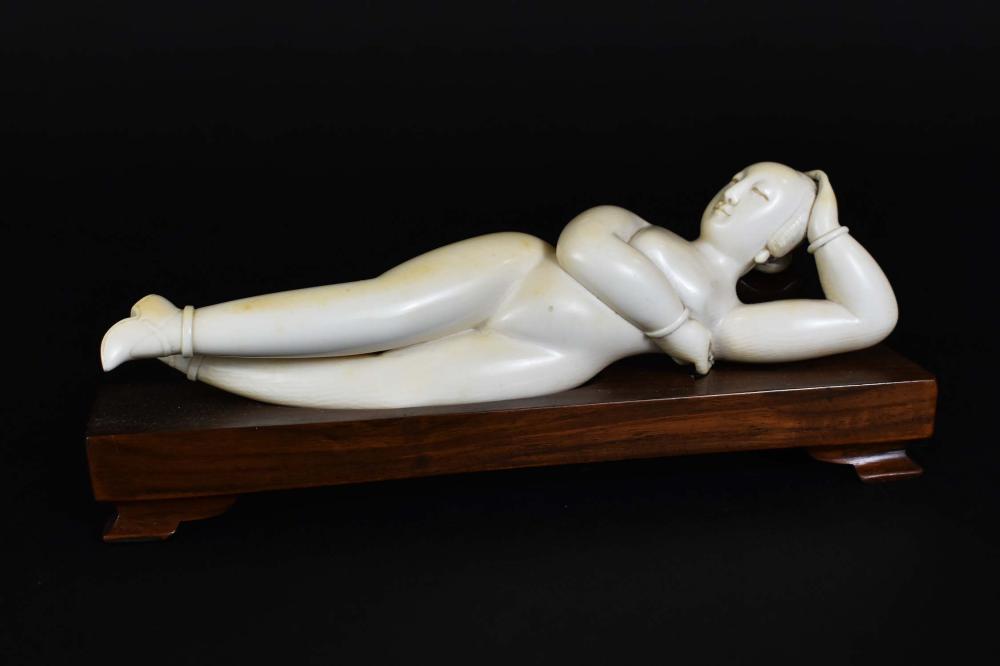 Appraisal: CHINESE CARVED DOCTORS MODELCirca The recumbent female nude her hair