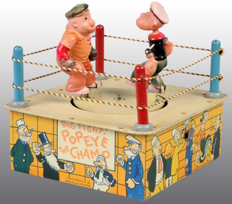 Appraisal: Marx Tin Celluloid Popeye the Champ Windup Toy Description American