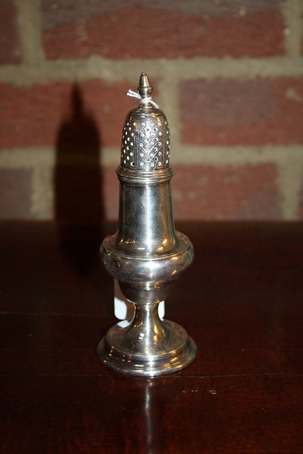 Appraisal: A GEORGE III SILVER BALUSTER SHAPED PEPPER standing on a