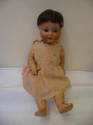 Appraisal: An Armand Marseille bisque head doll with blue lashed sleeping