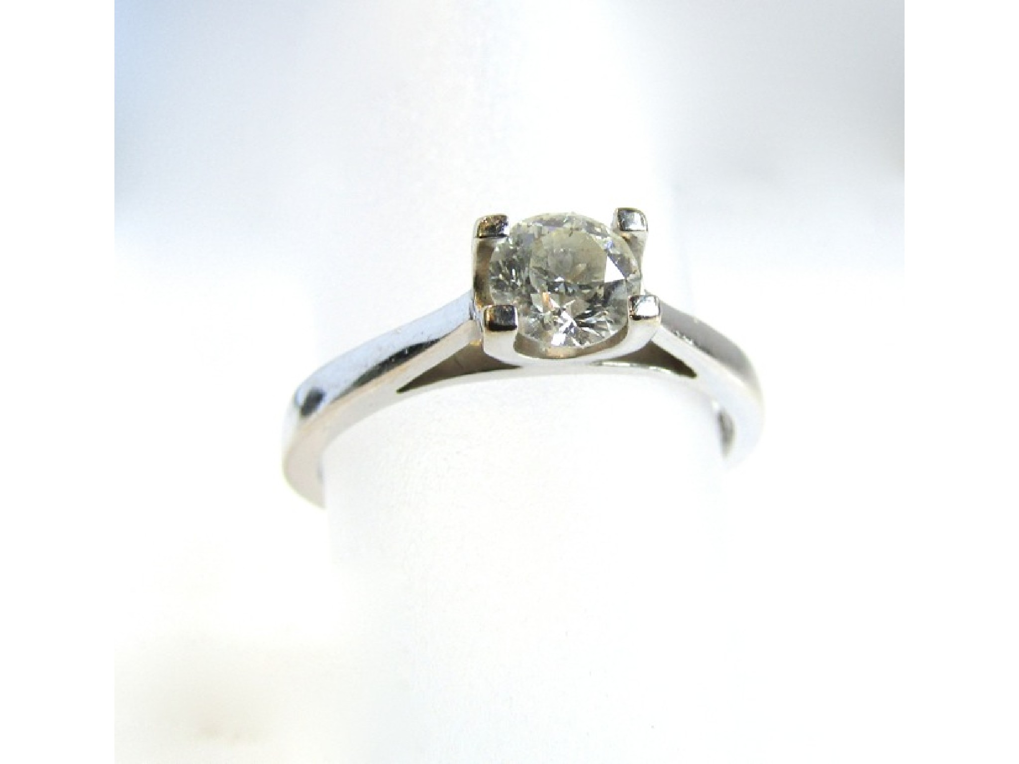 Appraisal: A single stone diamond ring Forever Diamonds set with a