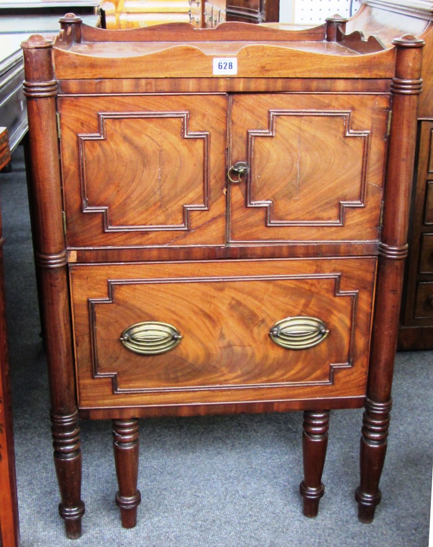 Appraisal: An th century mahogany tray top commode with outstepped turned