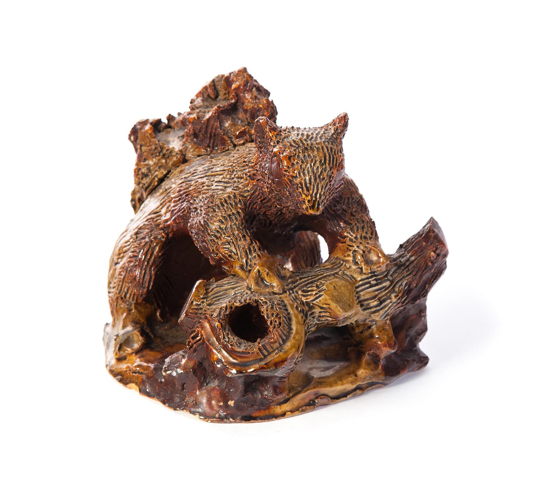 Appraisal: AMERICAN SEWERTILE SQUIRREL First half- th century Two-tone glaze h