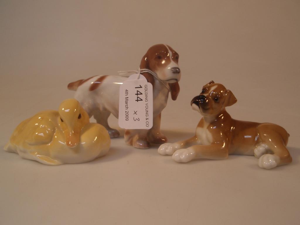 Appraisal: A Royal Dux figure of a spaniel Hutshenreuther figures of