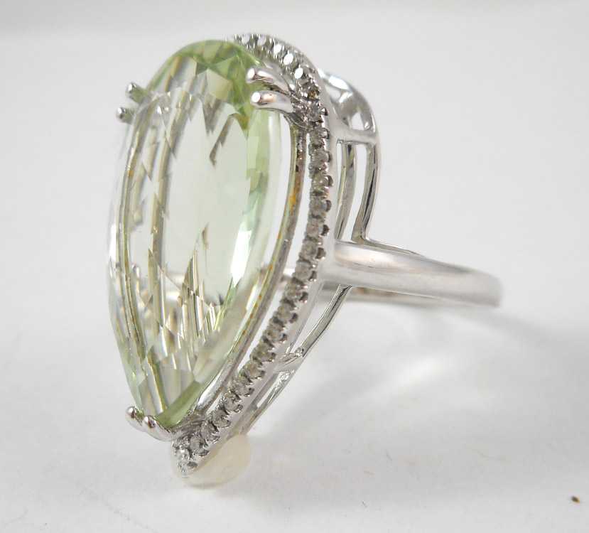 Appraisal: GREENED AMETHYST AND FOURTEEN KARAT GOLD RING The white gold