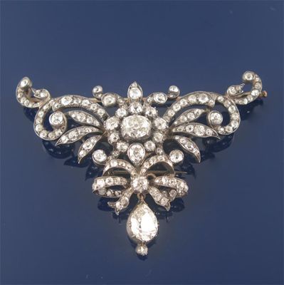 Appraisal: A late Victorian diamond set foliate scroll and bow design