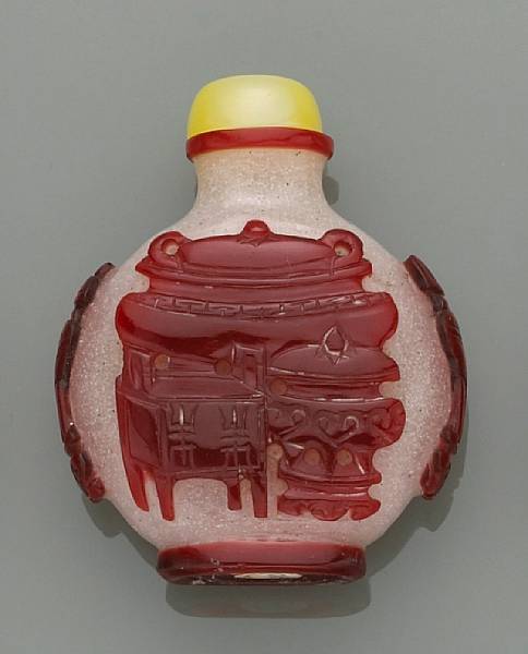 Appraisal: A snowflake glass bottle with red overlay decoration th Century