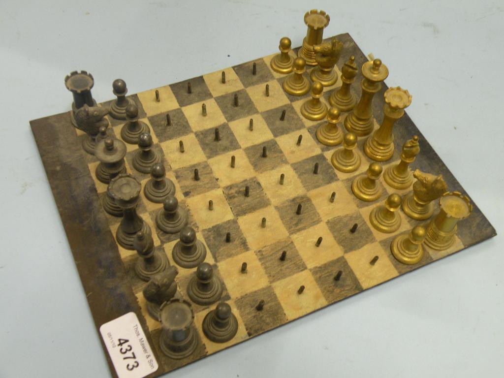 Appraisal: A thC gilt brass and steel travelling Campaign chess set