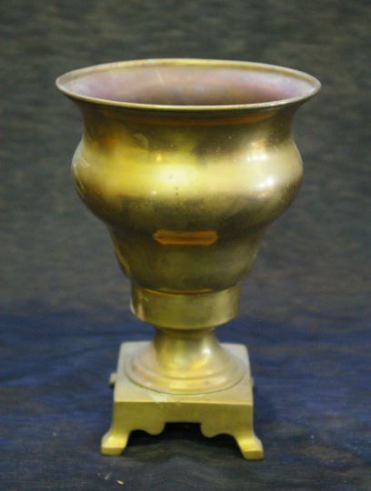 Appraisal: Russian Quatrepodal Brass Vase in the Petrine style fourth quarter