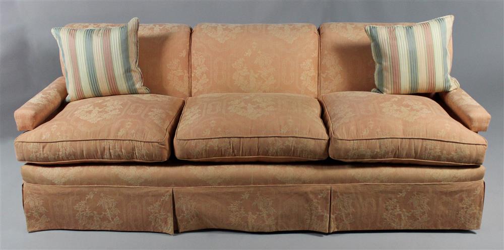 Appraisal: CONTEMPORARY UPHOLSTERED COUCH covered in light orange upholstery in a