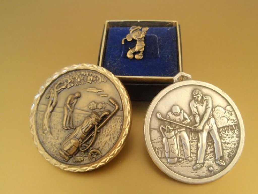 Appraisal: Two golfing medals and a Mickey Mouse golfing tie pin