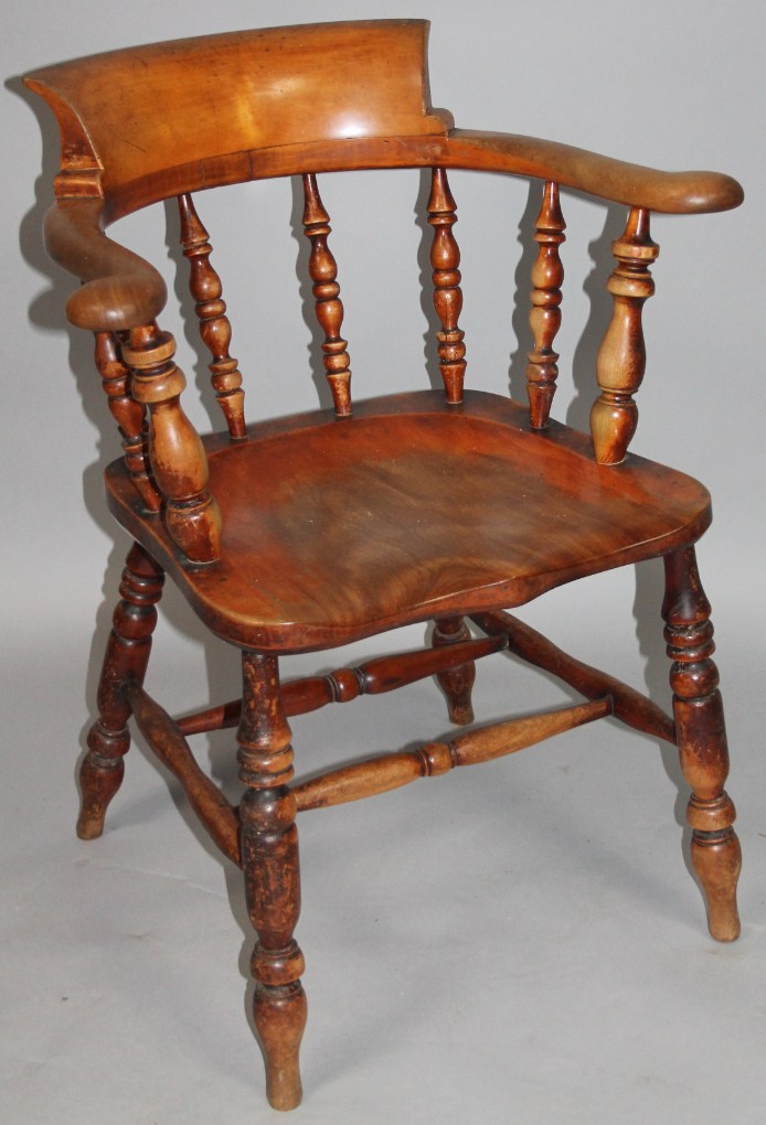 Appraisal: A thC ash and elm smoker's bow chair with a