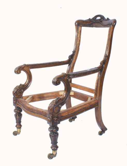 Appraisal: A GEORGE IV ROSEWOOD OPEN ARMCHAIR with carved cresting rail