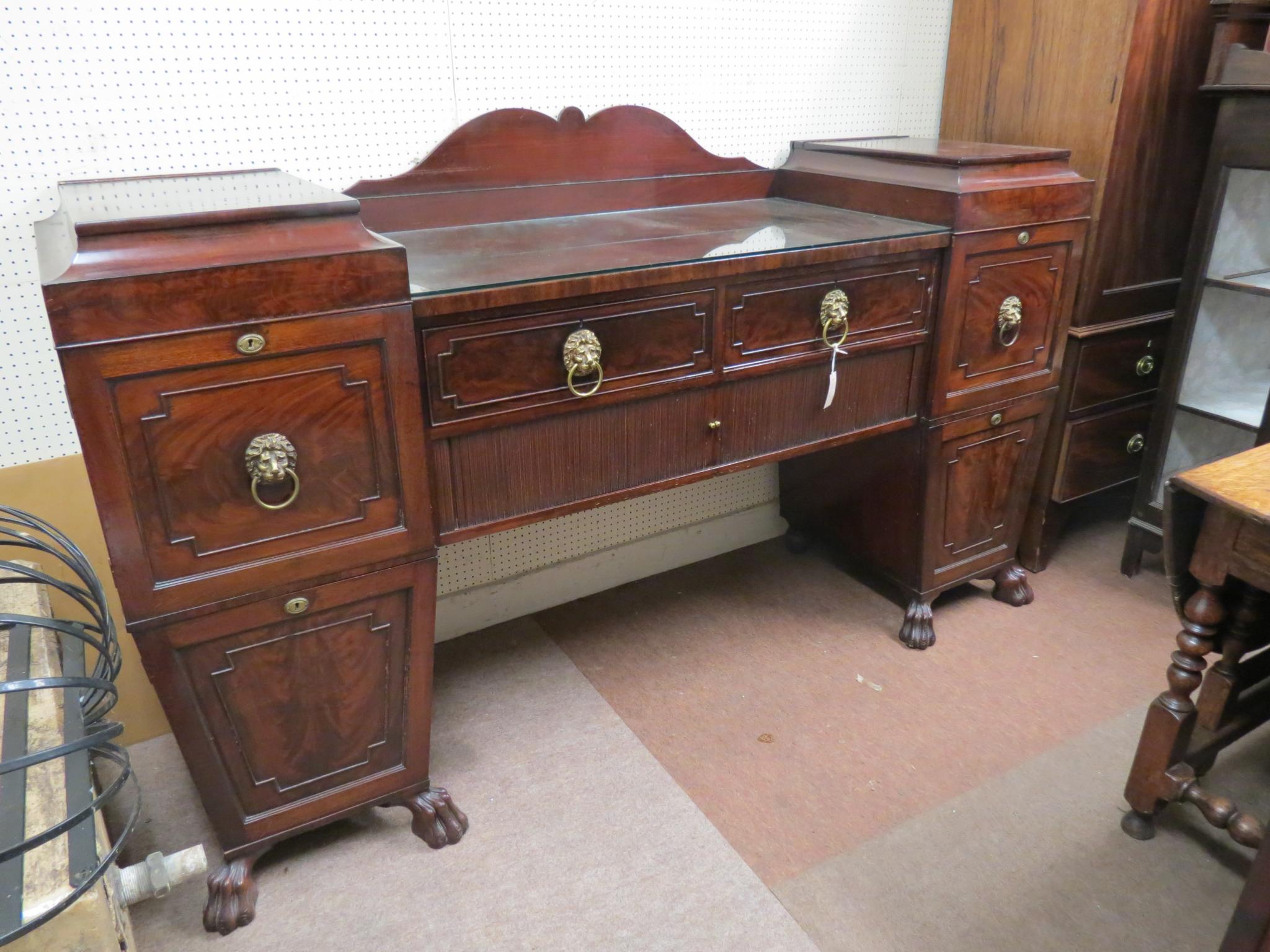 Appraisal: A Regency-period mahogany sideboard central section with two frieze drawers