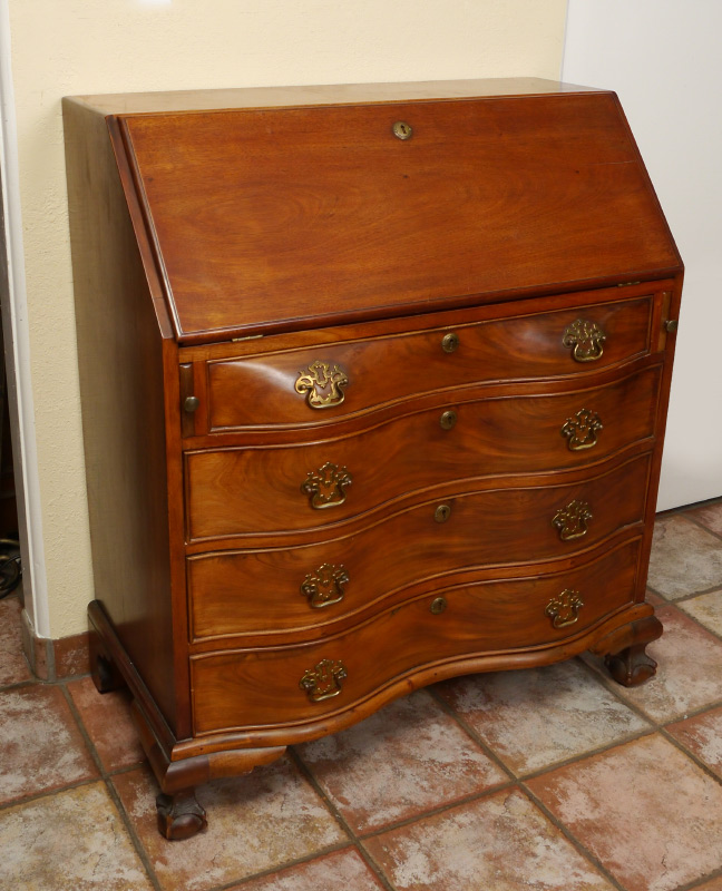 Appraisal: SLANT FRONT SERPENTINE SECRETARY DESK Mahogany slant front top interior