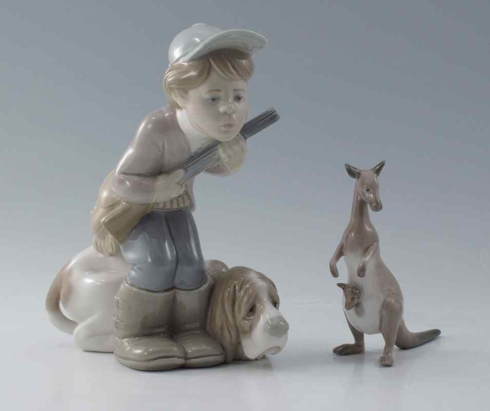 Appraisal: LLADRO PORCELAIN FIGURINES HUNTER PUPPET Juan Huerta designer glazed issued