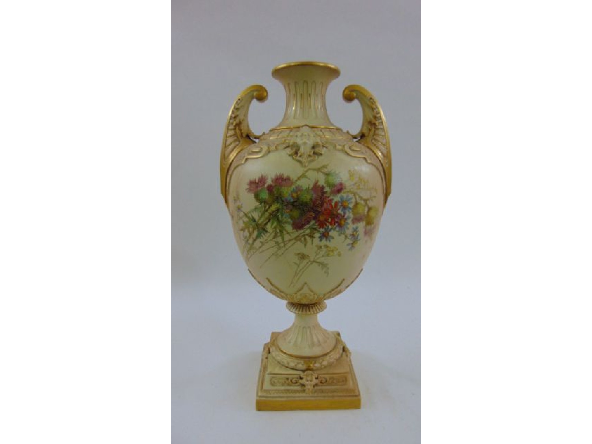 Appraisal: A substantial blush ivory oviform vase with open scrolled handles