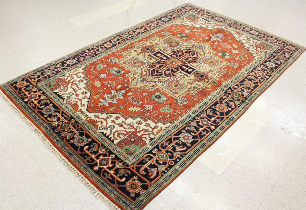 Appraisal: HAND KNOTTED ORIENTAL CARPET Indo-Serapi stylized floral and geometric central