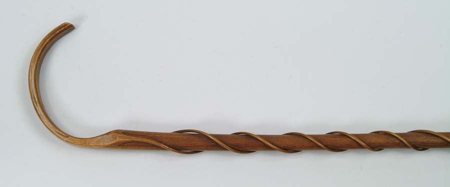 Appraisal: CANE INTERESTING CARVED VINE CANE C-shaped handle with two spiraling