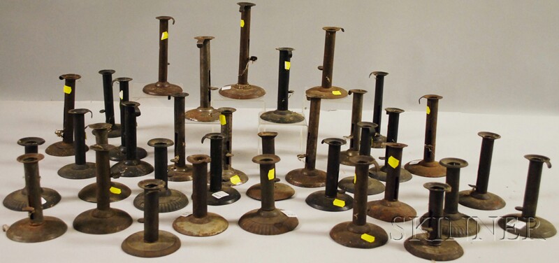 Appraisal: Thirty-four Tin and Metal Hogscraper Candlesticks