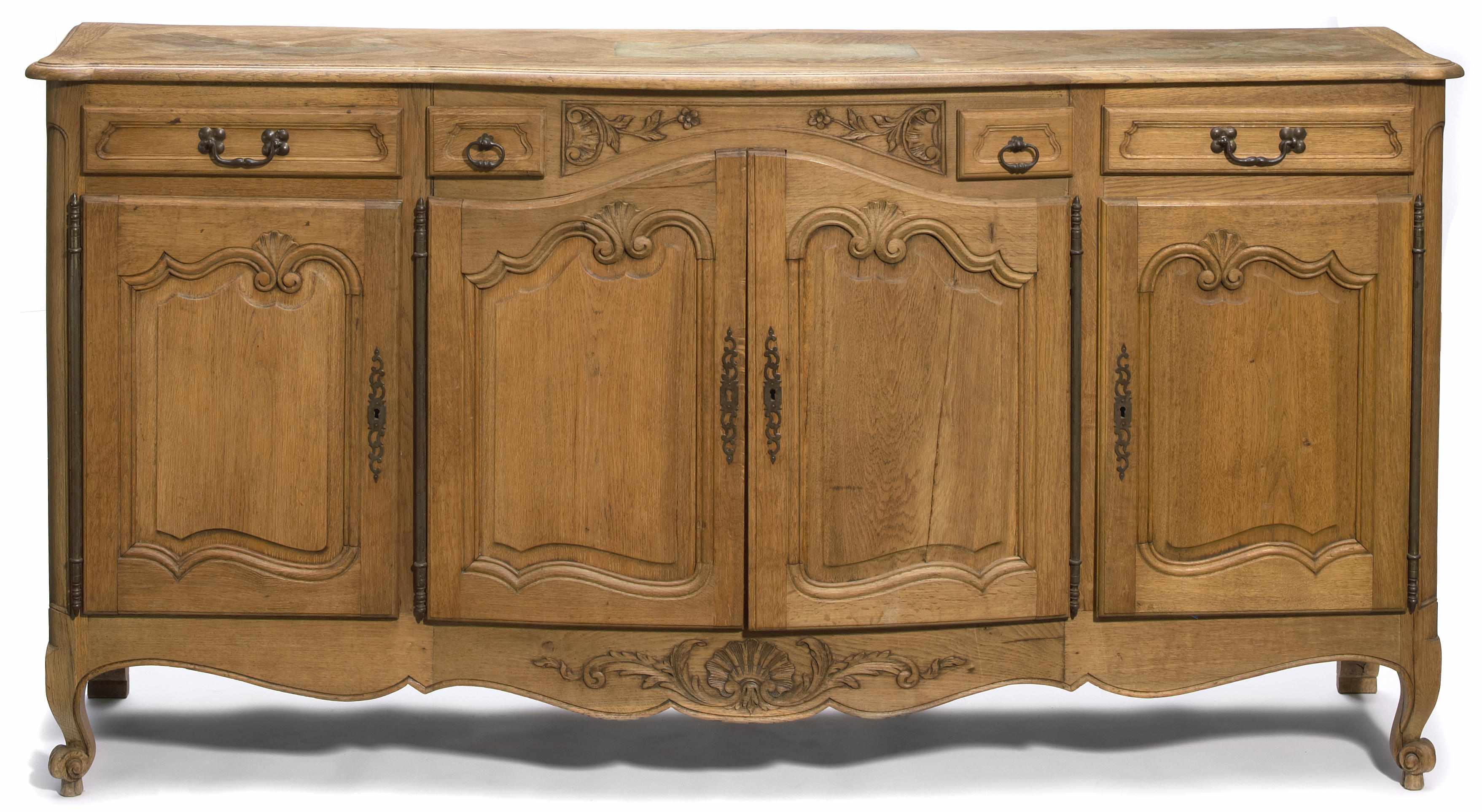 Appraisal: A Louis XV style carved oak buffet height in cm