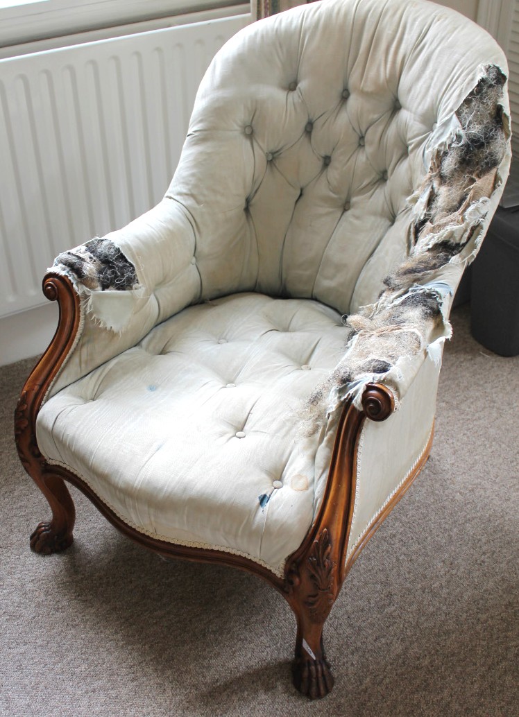 Appraisal: A Victorian walnut framed armchair with buttoned upholstery AF with