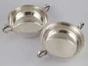 Appraisal: A pair of circular silver dishes with cast handles cm