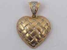 Appraisal: A ct gold heart pendant set with diamonds approx cm