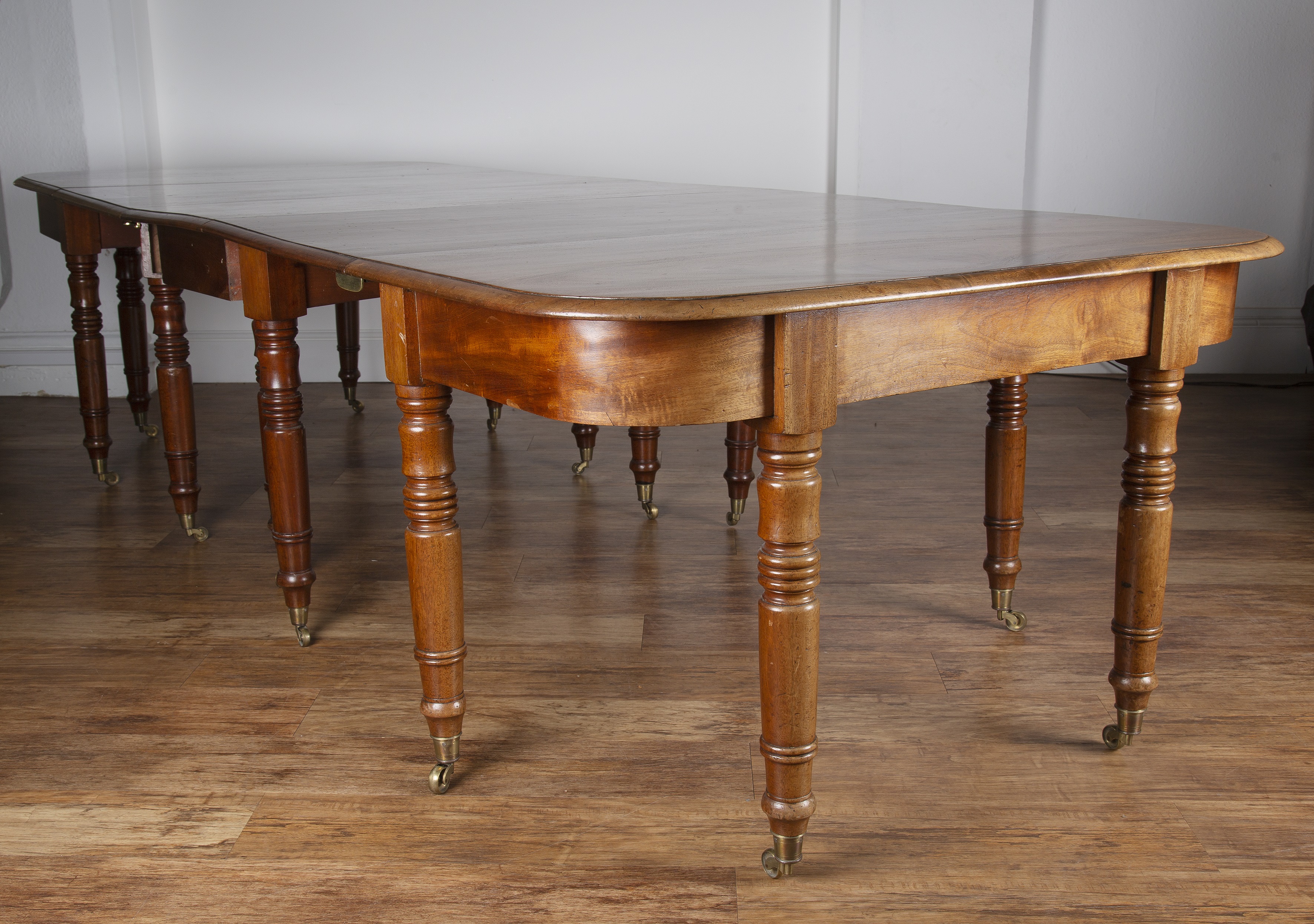 Appraisal: Mahogany D-end dining table th Century with central drop-leaf on