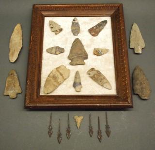 Appraisal: arrowheads spear tips A group of stone arrowheads and iron