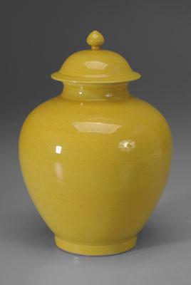 Appraisal: Chinese yellow-glazed lidded jar base with old paper labels impressed