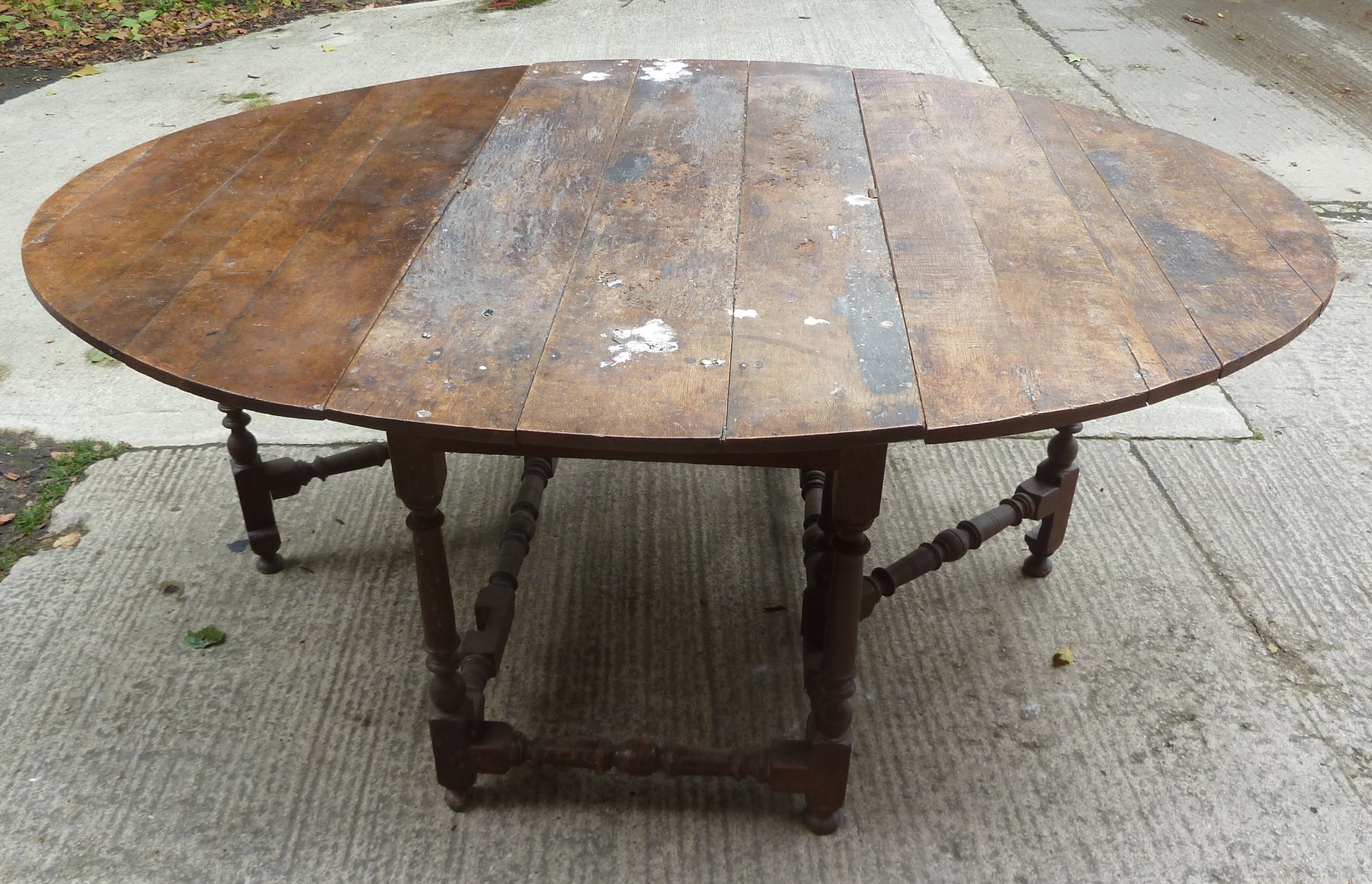 Appraisal: An oval gateleg table with distressed top cm wideProvenance Corsham