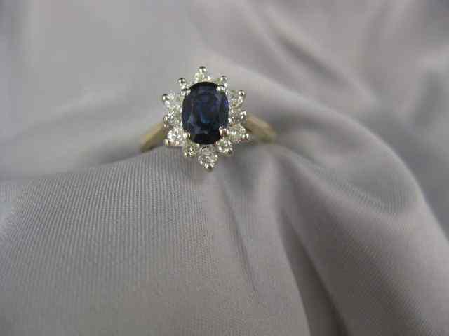 Appraisal: Sapphire Diamond Ring carat rich oval gem surrounded by diamonds