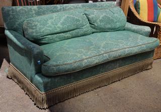 Appraisal: Moderne upholstered loveseat Moderne upholstered loveseat covered in green damask