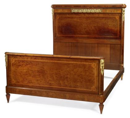 Appraisal: Louis XVI style walnut and satinwood inlaid bedstead early th