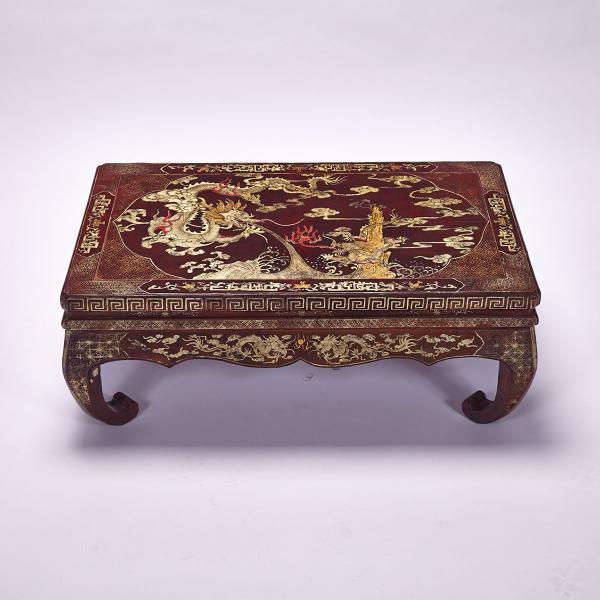 Appraisal: Red Lacquer Dragon Low Table With bold legs curved inward