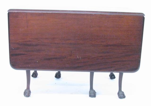 Appraisal: An antique mahogany rectangular drop leaf table double gate leg