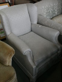 Appraisal: A pair of s upholstered armchairs with short cabriole legs