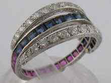 Appraisal: A white metal tests platinum interchangeable diamond ruby and sapphire