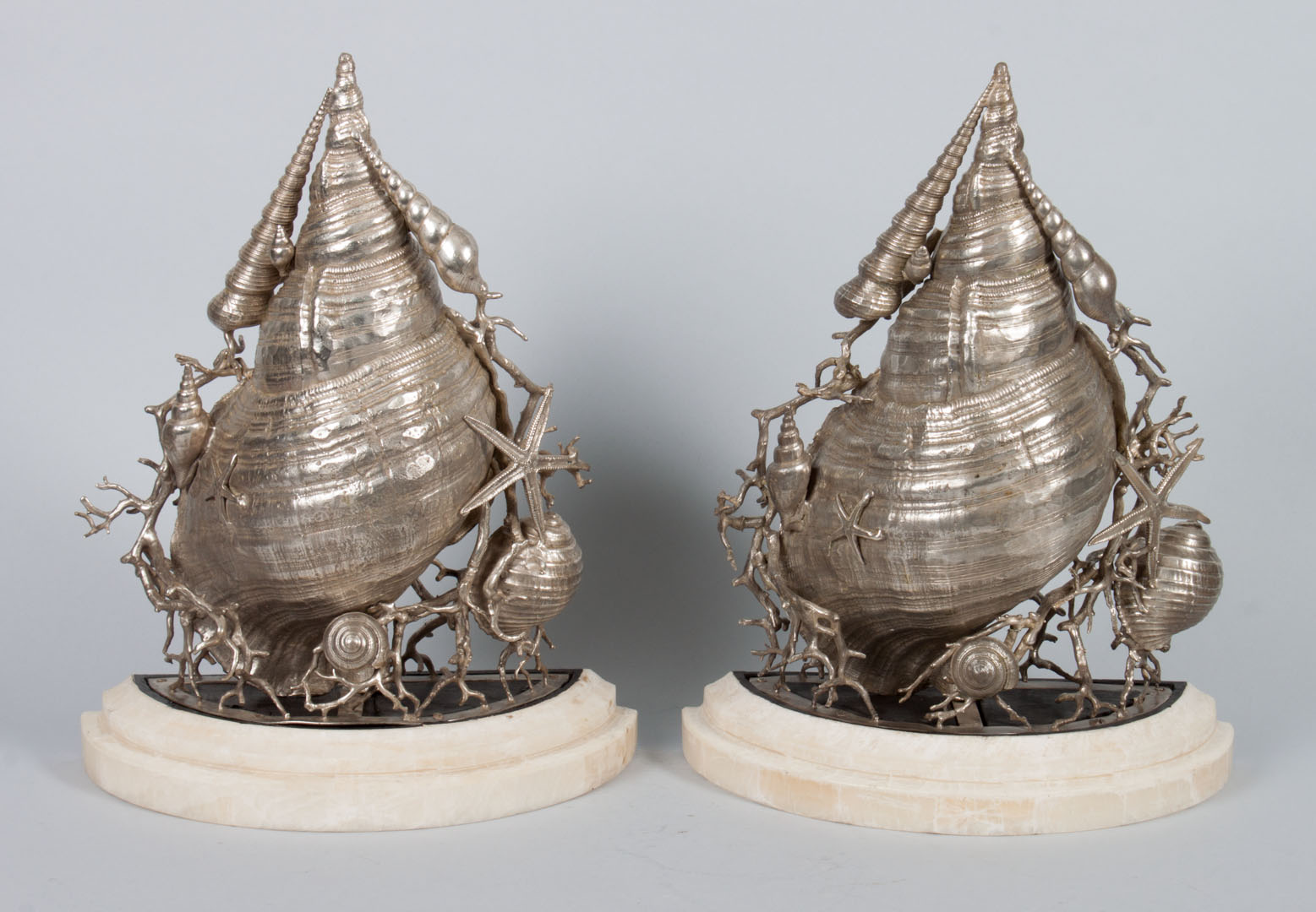 Appraisal: Pair of silvered bronze seashell wall brackets each modeled as