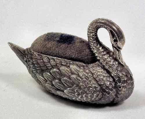 Appraisal: A George V silver ''Swan'' pattern pincushion ins high Birmingham