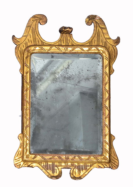 Appraisal: AN TH CENTURY GILTWOOD HANGING WALL MIRROR with scroll pediment