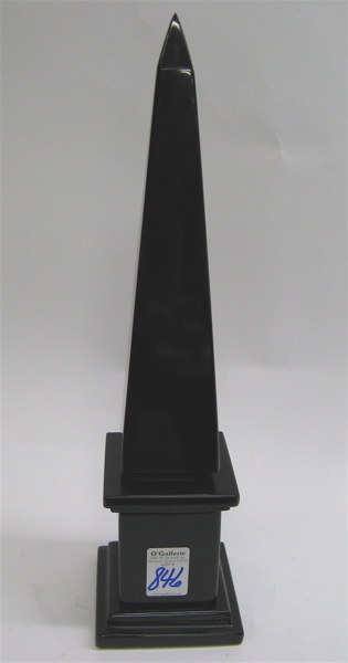 Appraisal: BLACK MARBLE SCULPTED OBELISK The tall slender four sided pillar