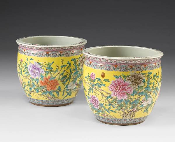 Appraisal: A pair of yellow ground porcelain planters with famille rose